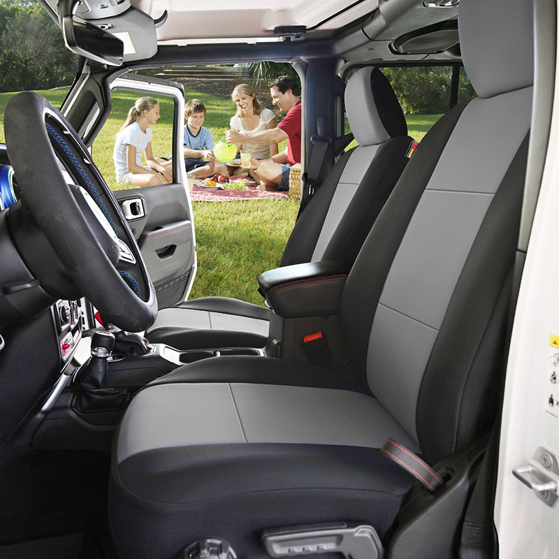 Car interior with gray Genuine Neoprene seats covers, showing a family picnic on a grassy area.