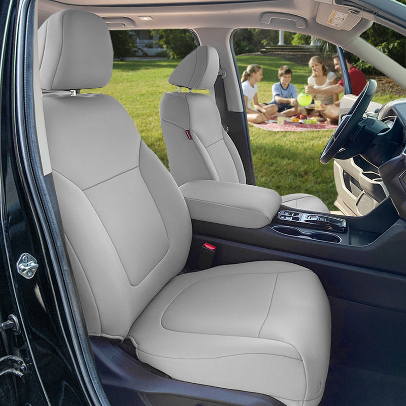 Car interior with gray Genuine Neoprene seats covers, showing a family picnic on a grassy area.