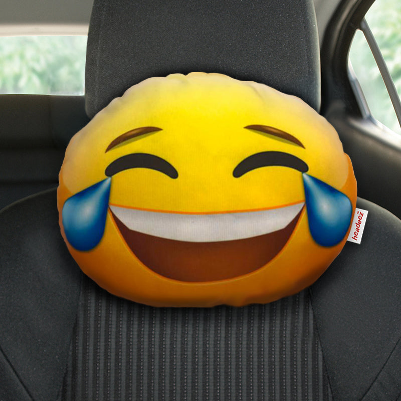 Happy Tears Emoji Travel Pillow on seat