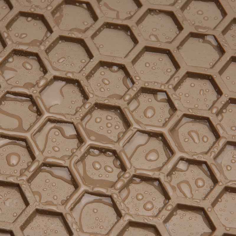 Close-up of surface of tan HexoMat with water drops.