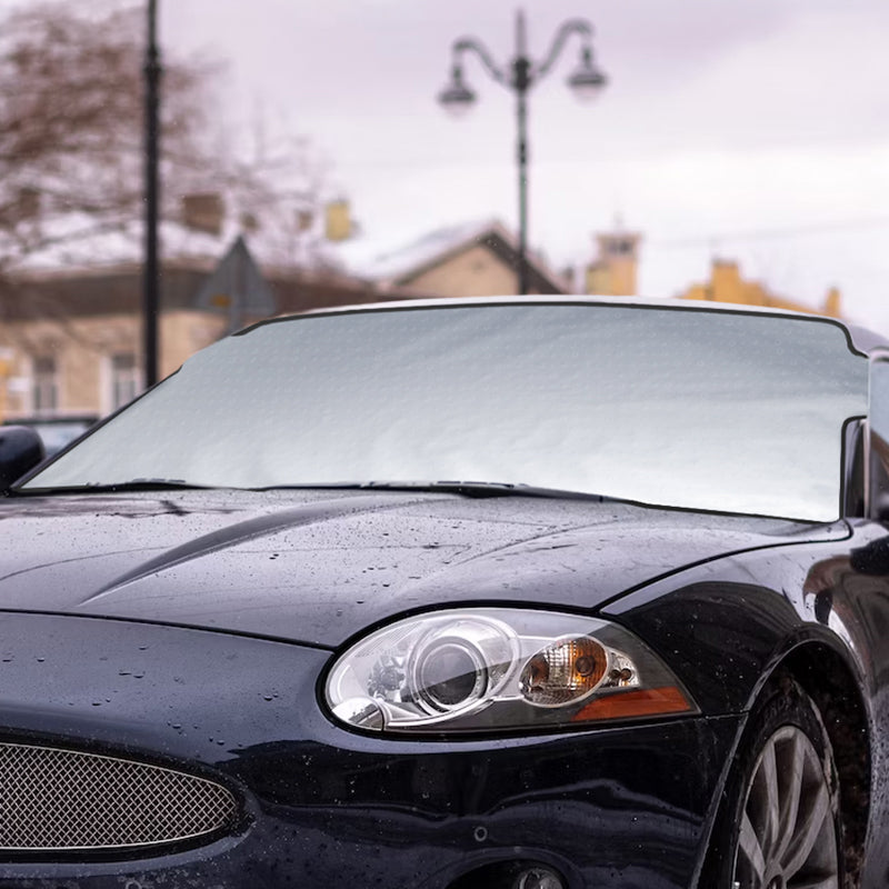 Jaguar with a SnowShade covering windshield in a snowy landscape