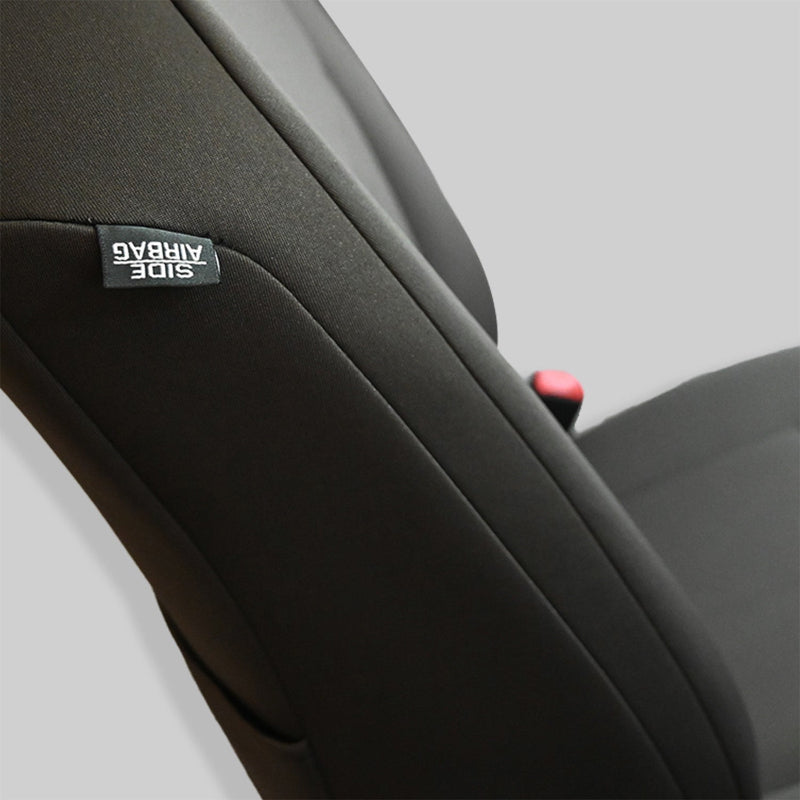 Closeup of Genuine Neoprene seat cover with airbag label