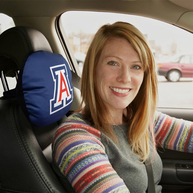 Woman in car with University of Arizona Travel Pillow