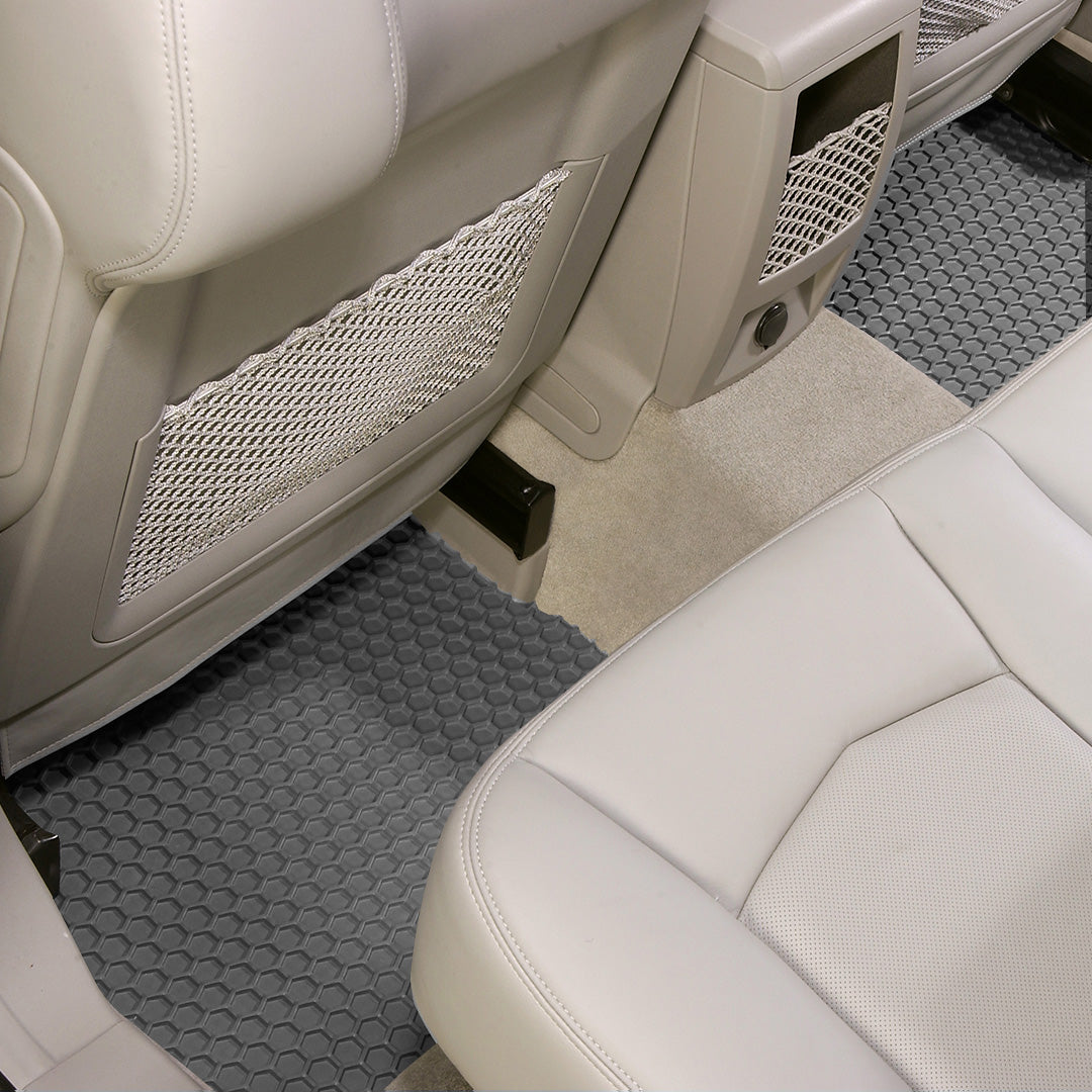 Car interior with gray HexoMats and beige seats
