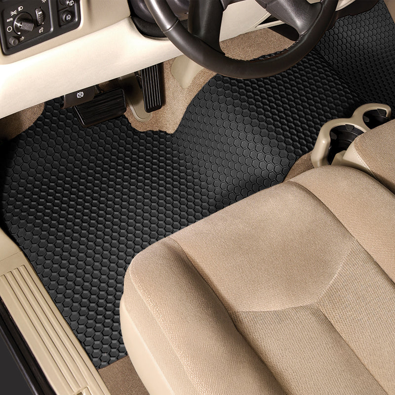 Car interior with black HexoMat 1-piece runner and beige seat