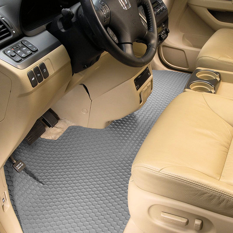 Car interior with gray HexoMat runner and beige seat