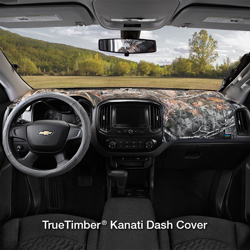 TrueTimber Kanati Camo dash cover with a field in the background