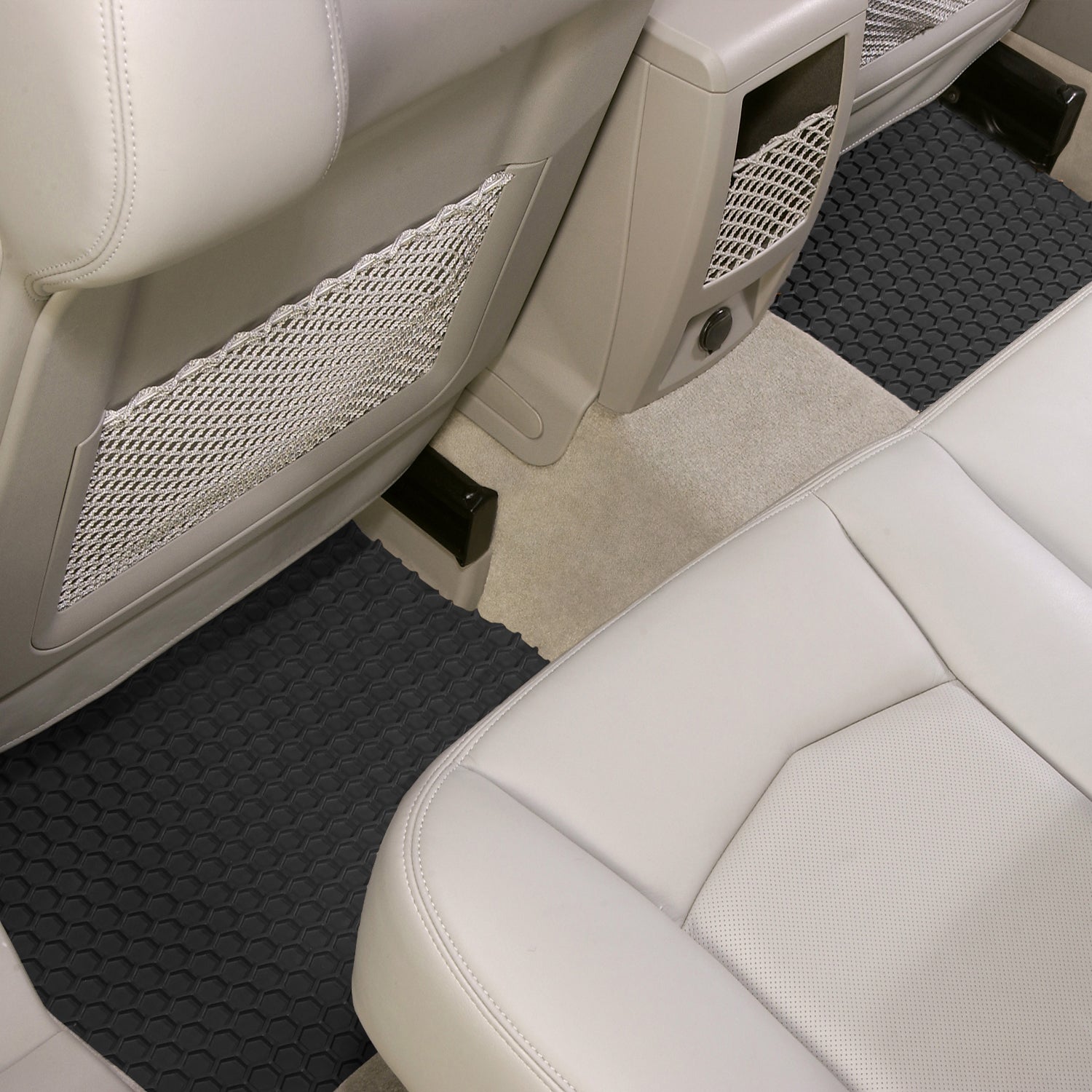 Car interior with black HexoMats and white seats.