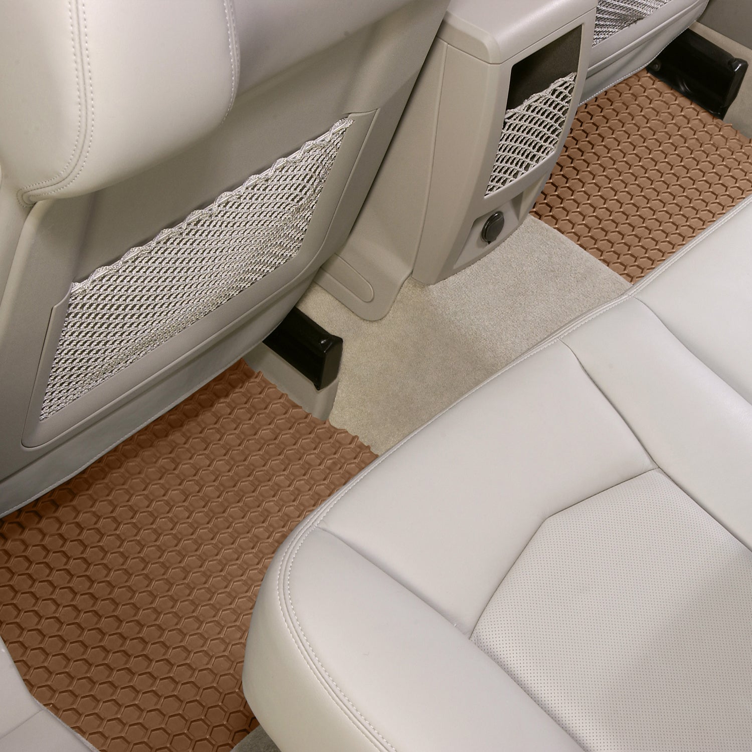 Car interior with tan HexoMats and white seats