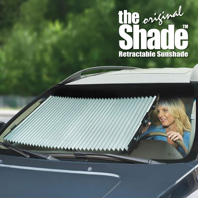 Retractable sunshade on a car window with 'the original Shade' branding.