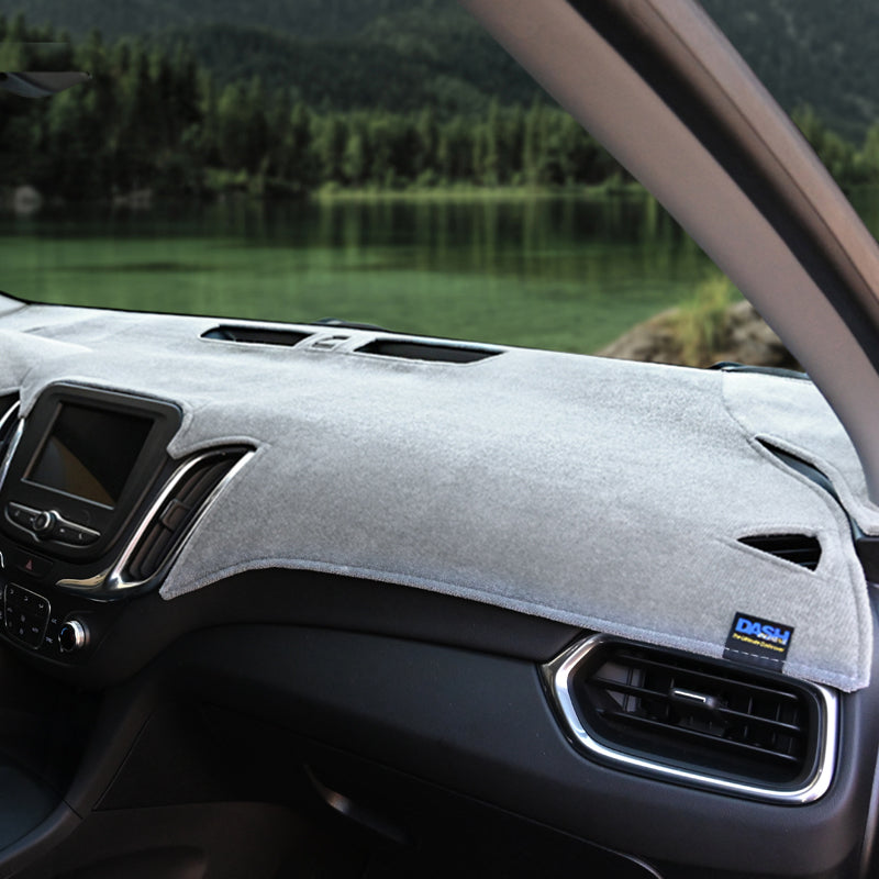 Plush Velour Gray dash cover with a lake in background