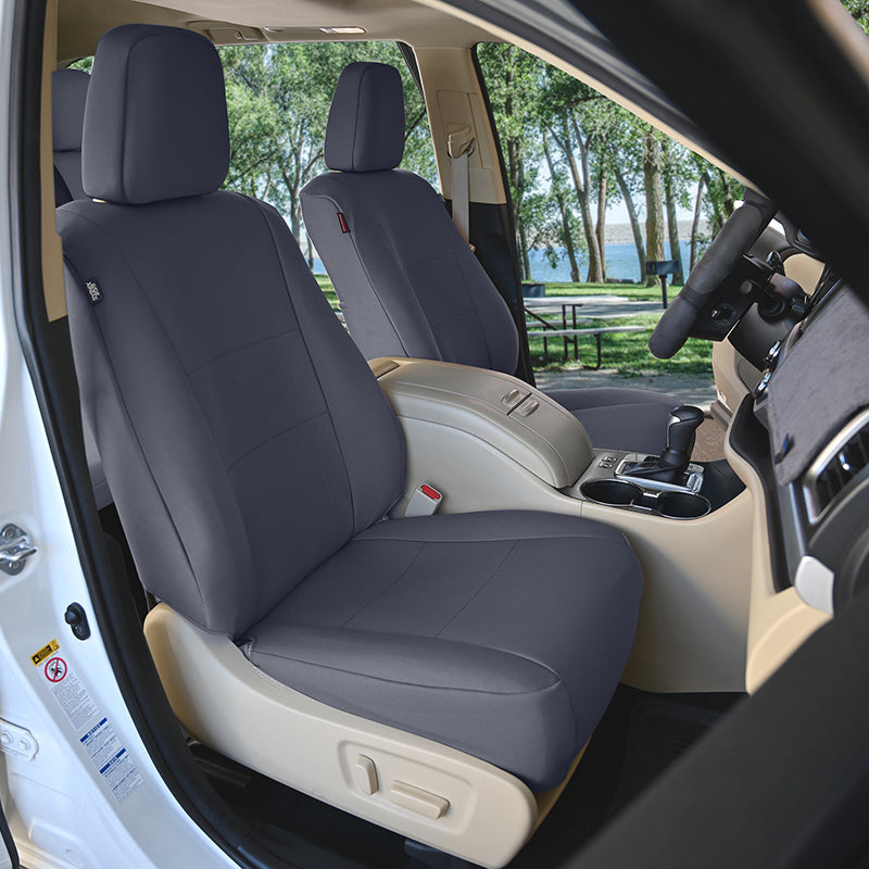 Seat Décor Kingston Charcoal seat covers and a view of trees and water outside.