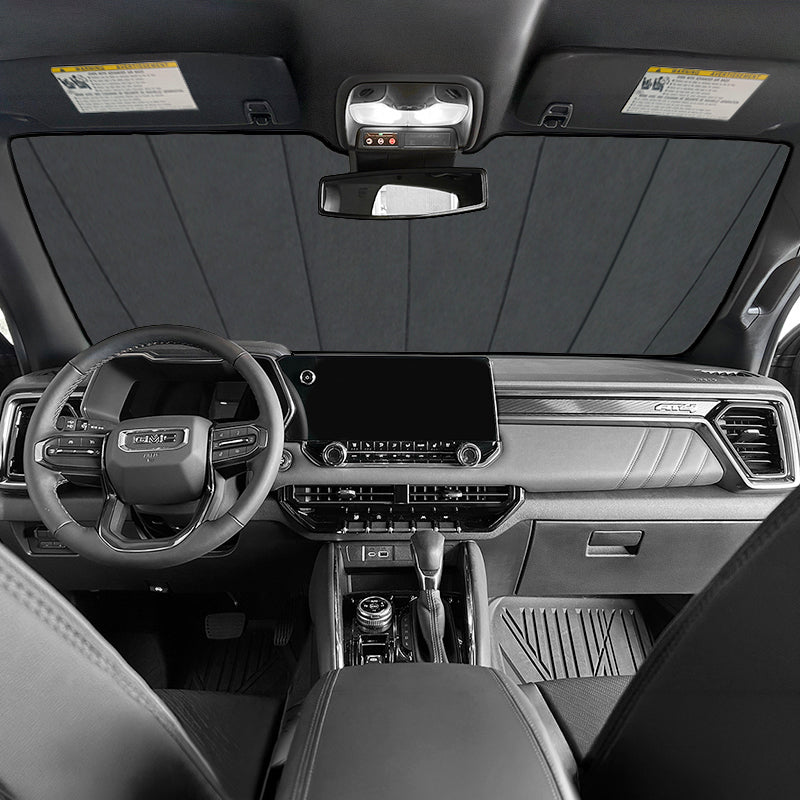 Car interior with an Ultimate Reflector sunshade covering the windshield