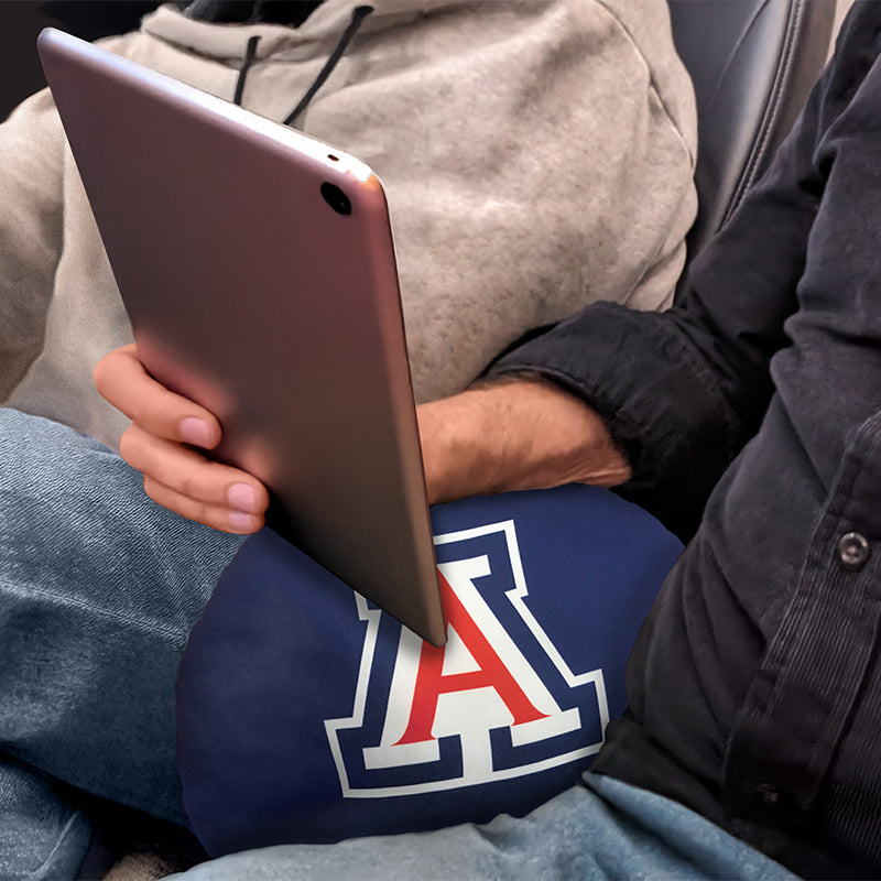 University of Arizona Travel Pillow supporting wrist of man holding a tablet